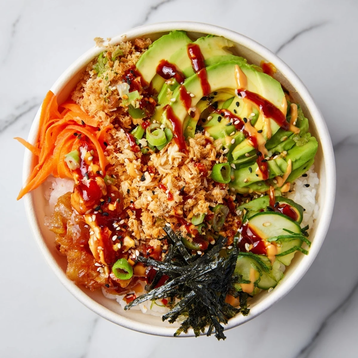 Crispy tempura bits topping a vibrant Crunch Roll Sushi Bowl with fresh veggies.  