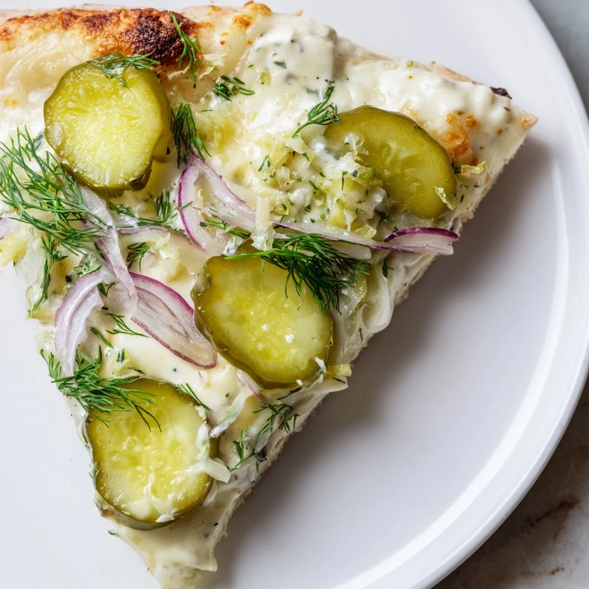Unique Pickle Pizza featuring melted cheese, fresh dill, and a burst of flavor.