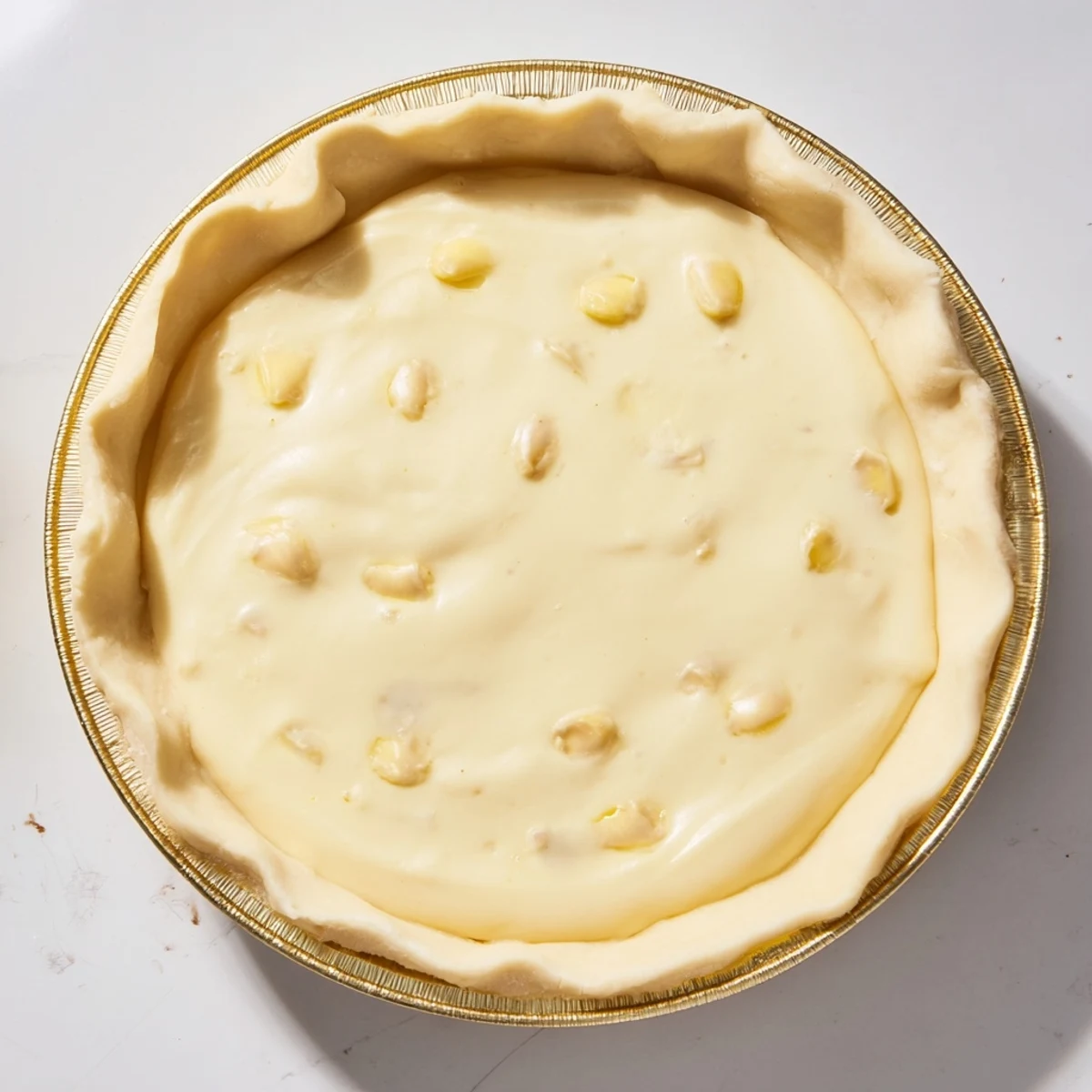 A golden, baked Water Pie with a crimped crust, ready for a comforting slice of homemade dessert.