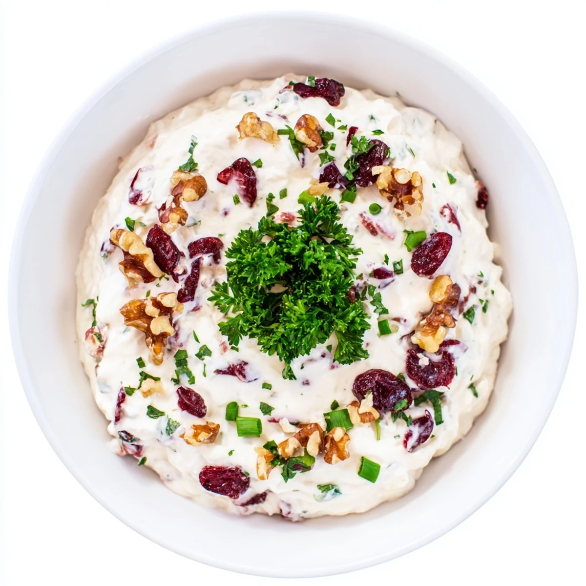 Creamy Lightened Holiday Cream Cheese Dip, perfect for dipping, packed with cranberries and fresh parsley.