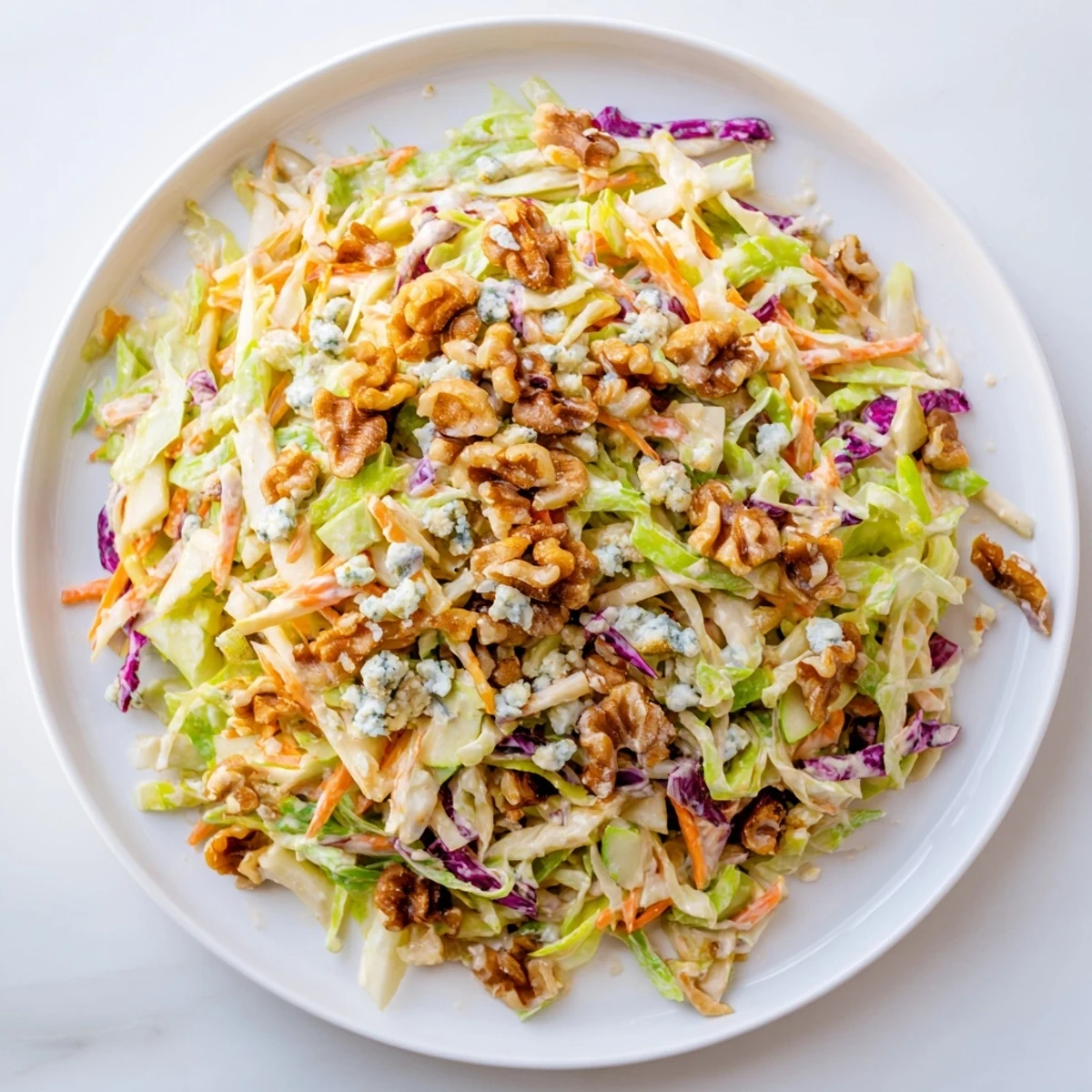 Fresh Crunchy Apple & Walnut Slaw: bright apples, walnuts, and blue cheese ready to serve as a side.
