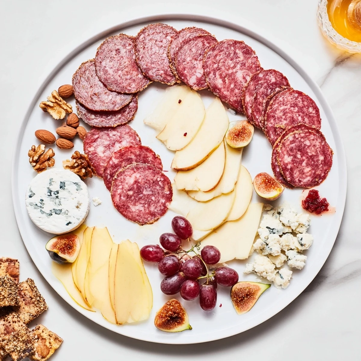 Artfully arranged Majestic Venison Charcuterie Platter: a feast of meats, cheeses, fruits, and nuts.