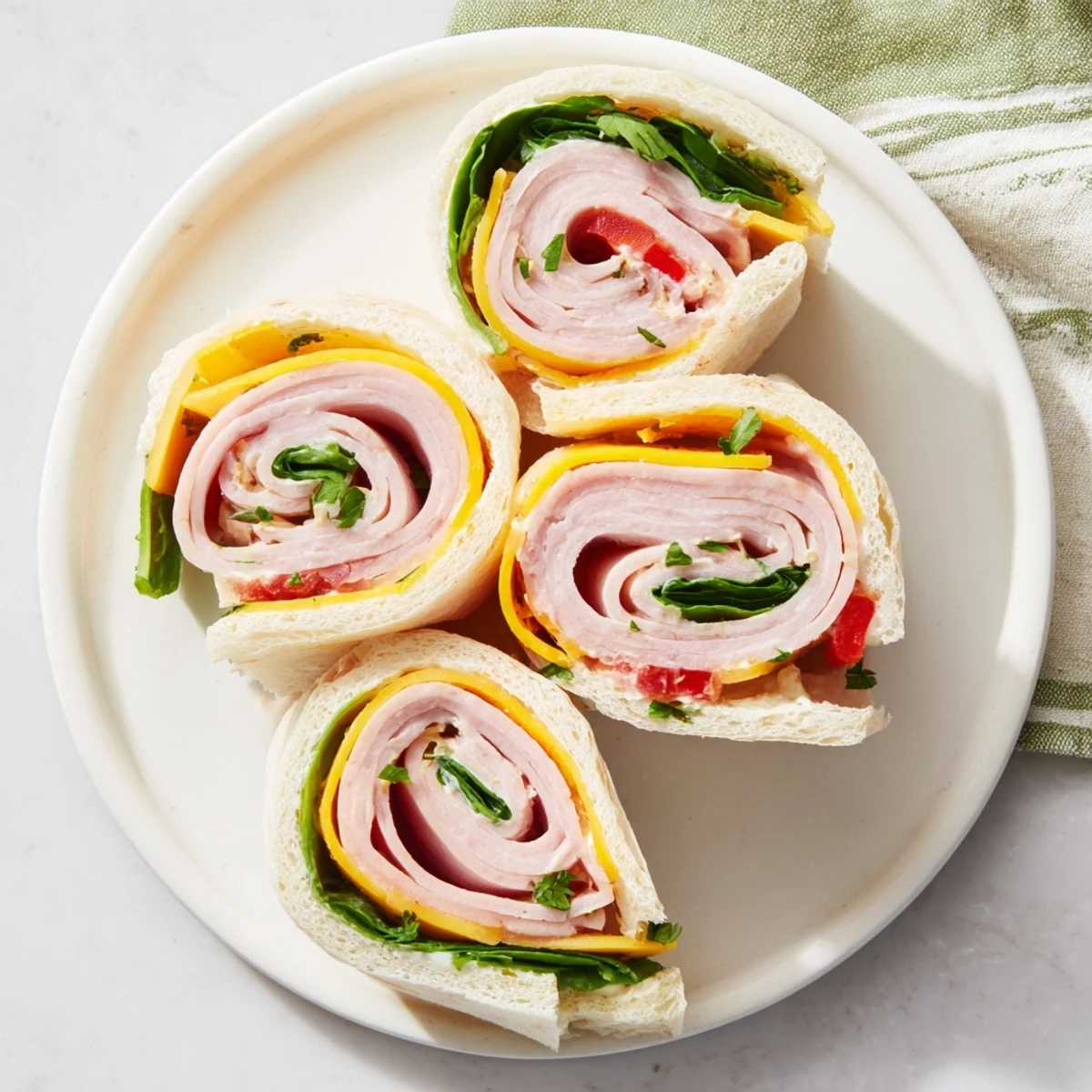 Imagine soft bread rolls filled with colorful layers ready to be eaten: star-shaped party sandwiches!