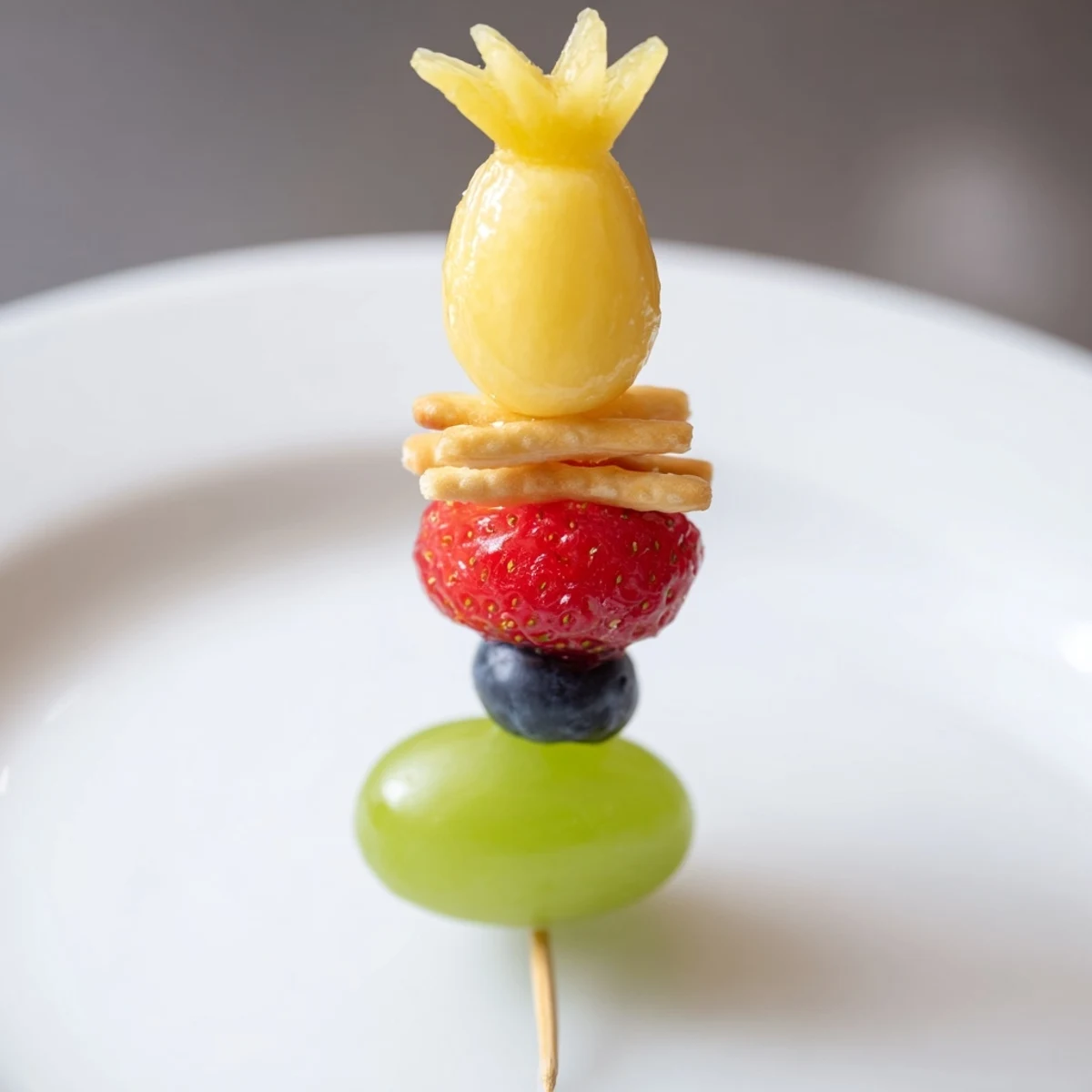 Vibrant Christmas Light Fruit Skewers with colorful fruit bulbs, perfect for a healthy snack platter.