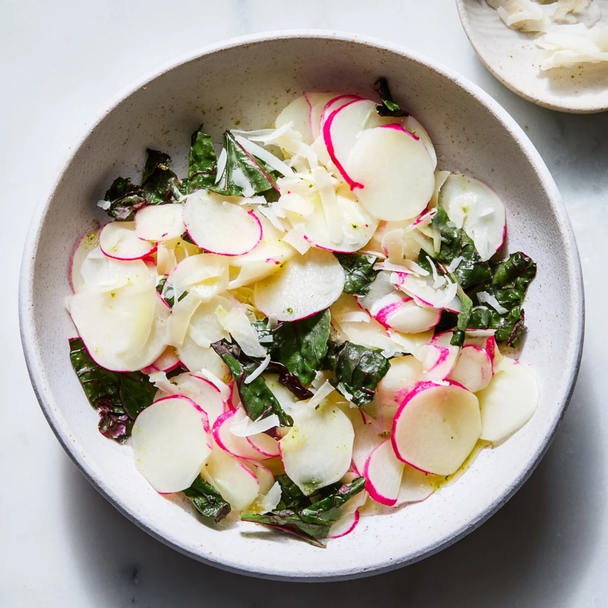 Artfully arranged Tundra Trek salad: a cold, refreshing dish with subtle flavors and fresh microgreens.