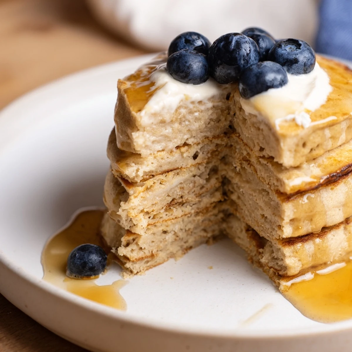 Golden, fluffy cottage cheese pancakes stacked high, perfect for a hearty and protein-rich breakfast.