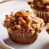 Fluffy cinnamon-spiced muffins filled with tender caramelized apples, perfect for dessert.