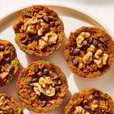 Deliciously spiced pumpkin tartlets topped with walnuts, ideal for sharing at holidays.