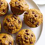 Freshly baked pumpkin chocolate chip muffins, oozing with rich dark chocolate goodness.
