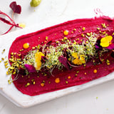 The visually striking "Modernist Stripe" appetizer includes a beet purée stripe with carrot, avocado, and beautiful edible embellishments.