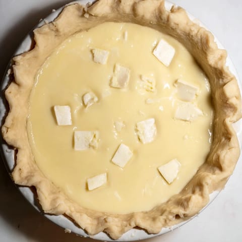 Cool, creamy Water Pie, sliced and served, offering a simple yet elegant, light dessert option.