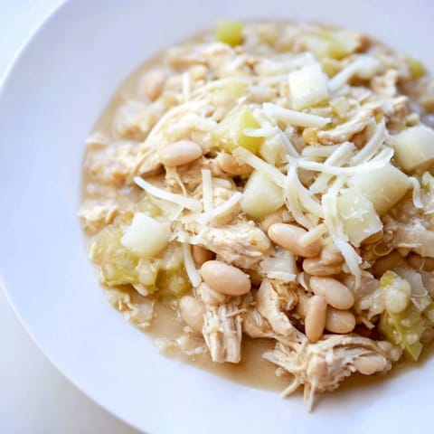Close-up of a warm, rich 35-Minute White Cheddar Apple Chicken Chili, ideal for a chilly evening.