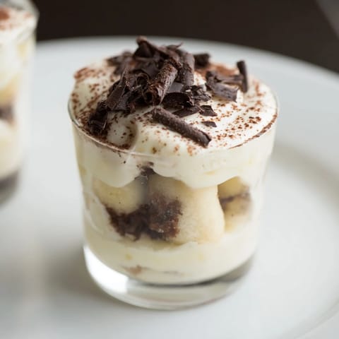 Individual Countdown Tiramisu Shots with coffee-soaked ladyfingers, a perfect Italian dessert.