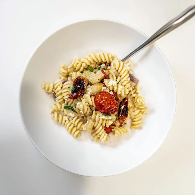 Delicious Baked Feta Pasta served warm, drizzled with olive oil and extra herbs.