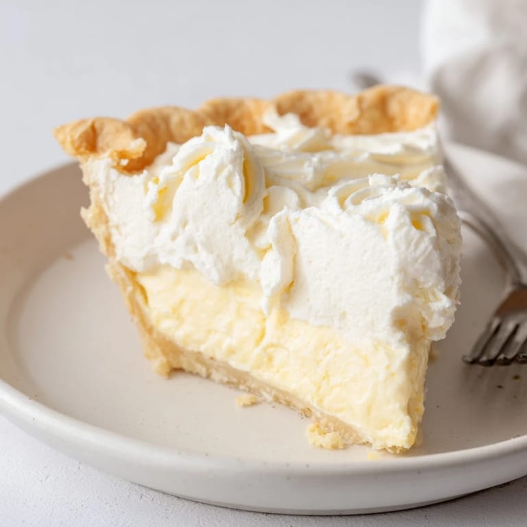 Sliced water pie showcases its delicate vanilla flavor, a nostalgic treat from the Great Depression.