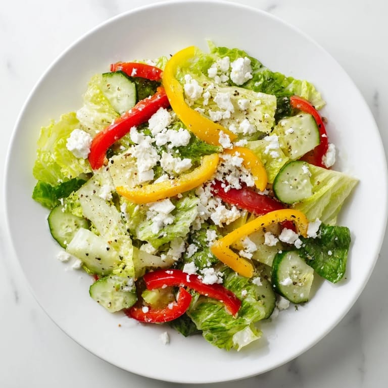 Freshly tossed Bella Hadid Salad, a light and refreshing mix with crunchy cucumbers and crumbled feta.