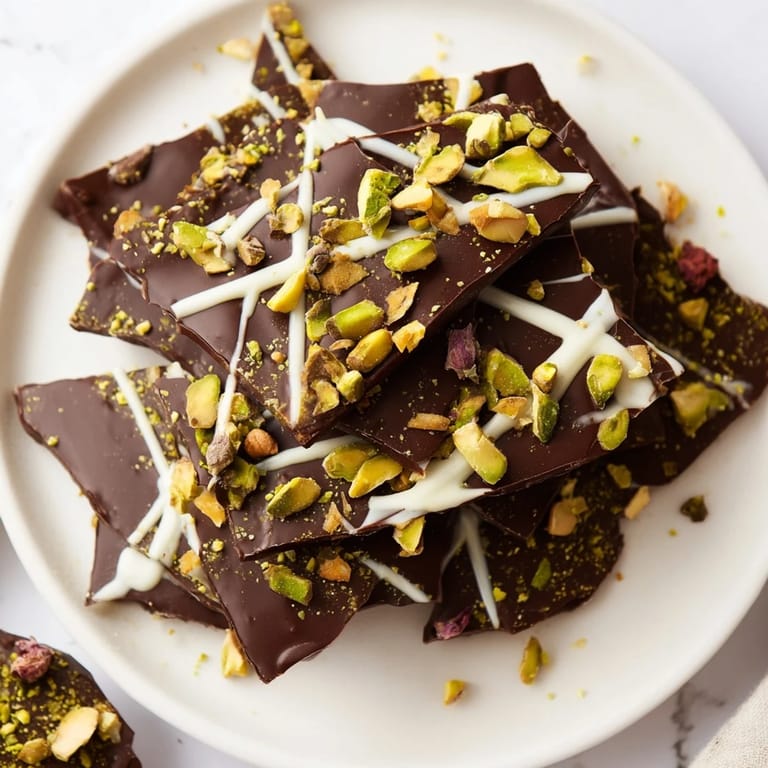 Golden phyllo topping a tray of Pistachio Dubai Chocolate Bark, ready to be broken into delectable pieces.